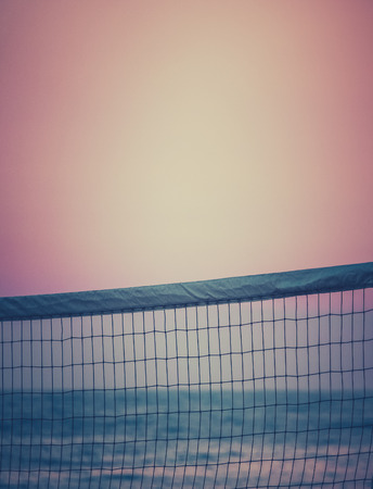 Retro Filtered Beach Volleyball Net At Sunset With Copy Spaceの写真素材