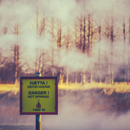 A Danger Hot Springs Sign In Iceland With Steamの写真素材
