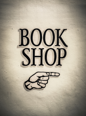 Vintage Book Shop Sign With A Pointing Handの写真素材