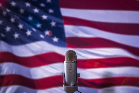 A Microphone In Front Of A USA Flag Ready For A Public Address From The President Or Other Government Figureの写真素材