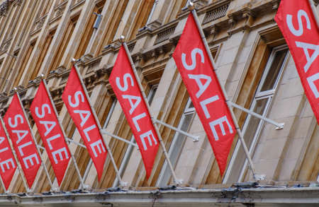 Multiple Large Signs Advertising A Major Sale At An Urban Department Storeの写真素材