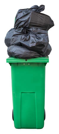 A Green Wheelie Bin, Overflowing With Bin Bags (Trash), Isolated On A White Backgroundの写真素材