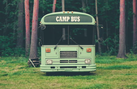 A Bus For Taking Kids To Summer Camp In A Beautiful Forestの写真素材