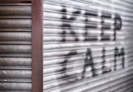 Urban Scene With 'Keep Calm' Written In Spray Paint On Some Shutters, With Shallow Depth Of Focusの写真素材