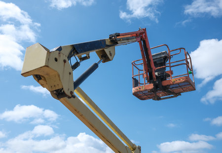 An Elevated Construction Crane Or Aerial Work Platform Or Cherry Picker Or Boom Lift Against A...