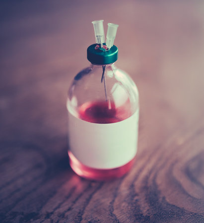 A Medical Vial (or Bottle) Of Sedative With Two Injection Needles In The Stopperの写真素材