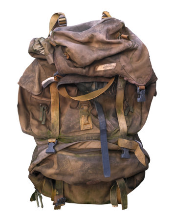 Old Worn Military Style Canvas Backpack With Straps And Buckles Isolated On A White Backgroundの写真素材