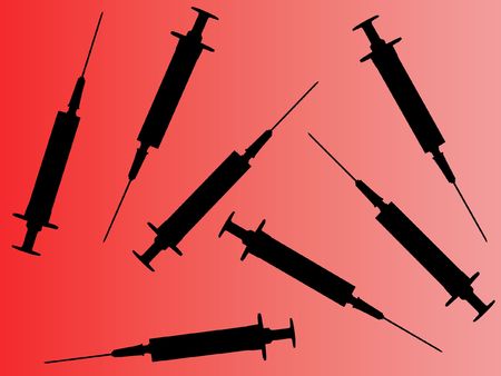 Syringes on gradient red  backgroundの写真素材