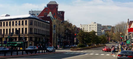 Street scene in Washington, DC, near DuPont Circle.  Clear, blue sky.  Bright, sunny day.  Light...