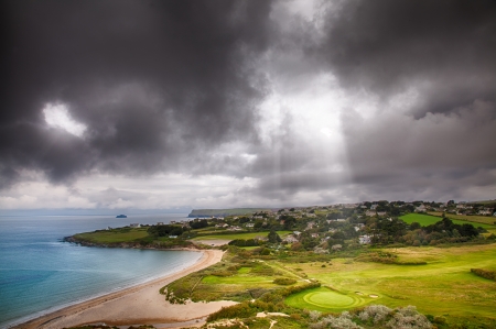 Landscape with light beam onto golf courseの写真素材