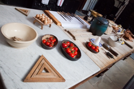 Old manor house kitchen and food preperation tableの写真素材