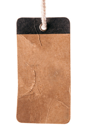 Blank old brown label with string on a white の写真素材