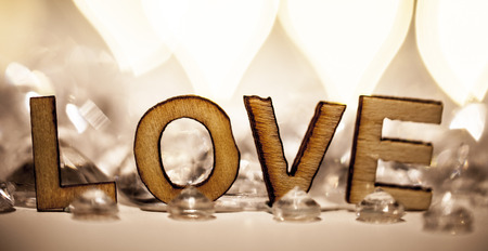 Romantic love word in wooden letters and diamondsの写真素材