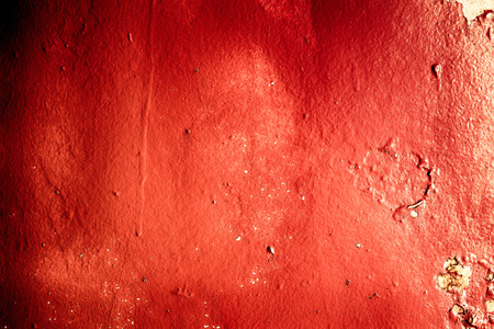 Textured red metal grunge background with distressed paint rust and decayの写真素材