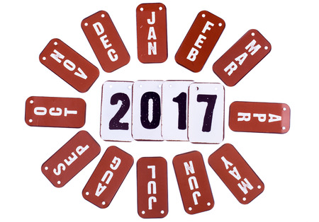 2017 year symbols and red month tiles around the date. Isolated on a white backgroundの写真素材