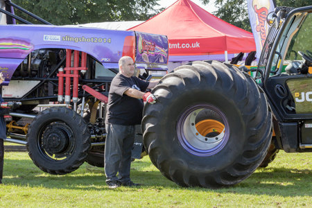 NORFOLK, UK - AUGUST 19th, 2017: Truckfest Norwich is a transport festival. Monster truck wheel changeのeditorial素材