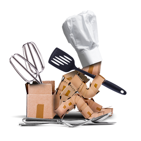 Chef box character sat thinking with chefs hat and kitchen utensils including spatula, whiskes, fork, knife and spoon. White background. Kitchen and cooking concept artwork.の写真素材