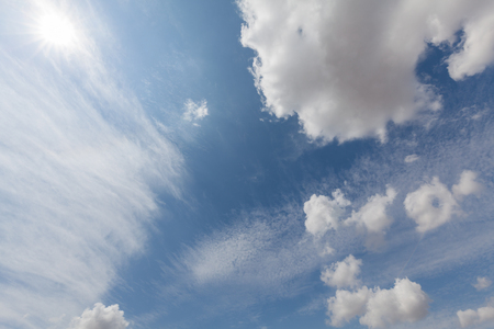 Beautiful white clouds and blue sky background over England UK. Fluffy and wispy cloudscape backdropの写真素材