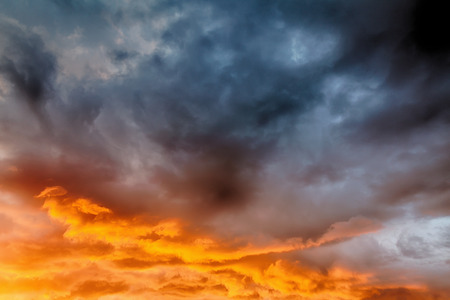 Beautiful clouds and blue sky background at sunset with pink and purple tones over England UK. Cloudscape and skyscape backdropの写真素材