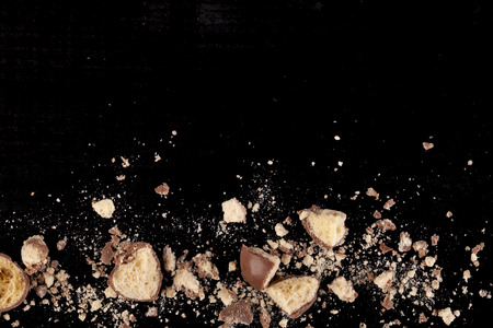 Chocolate honeycomb crumbs with bit and peices broken up on the bottom of teh imageの写真素材