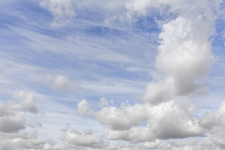 Great blue sky with white clouds background. No people or horizon nothing but sky.の写真素材