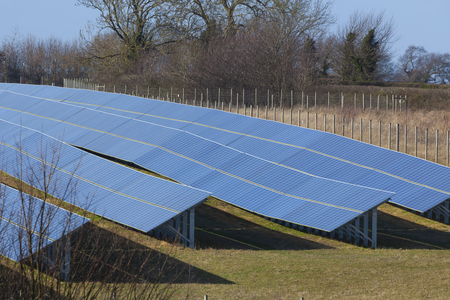 Solar panels farm photovoltaic modules installed in a large area for commercial green energy supply to the national grid, UK.の写真素材