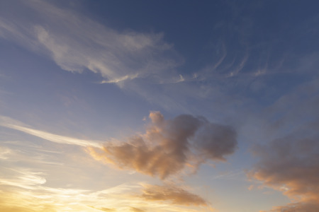 Gorgeous sunset clouds and orange colors. Cloudscape and evening sky backgroundの写真素材