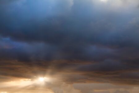 Stunning sunset cloudscape with dark clouds, story evening weatherの写真素材
