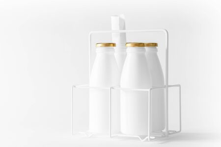 High key, white artwork image of used bottles. Still life black and white art of recycled waste objects displayed as pretend milk containersの写真素材
