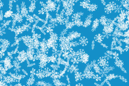 Blue frozen snowflake pattern with falling snowflakes wallpaperの写真素材