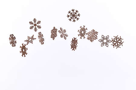 Snowflake pattern with falling snowflakes on a white background with copy spaceの写真素材