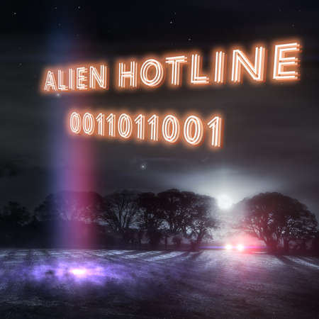 "Alien Hotline" slogan with UFO landing lights and a car headlights in a dark winters night field. Part of a series of fun UFO designs by Simon Bratt Photography. Nobody was reported abducted in the making of this scene. Social distancing was observed.の写真素材
