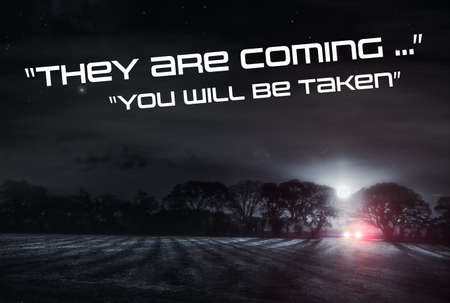 They are coming, you will be taken. Car parked on a moon lit misty winters night in a rural Norfolk field. Stars and full moon light the sky. Why are they out here in the dead of night? Are they looking for you!の写真素材
