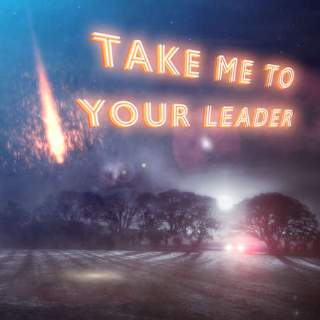 "Take Me To Your Leader" neon slogan with UFO falling to earth and a car with headlights looking for aliens in a dark winters night field. Part of a series of fun UFO designs by Simon Bratt Photography. Nobody was reported abducted in the making of this scene. Social distancing was observed.の写真素材