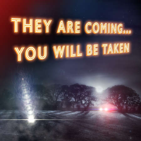 "They Are Coming..." slogan with UFO aliens falling to earth and a car with headlights looking for aliens in a dark winters night field.の写真素材