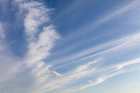 White wispy cloud lines with blue skies backgroundの写真素材