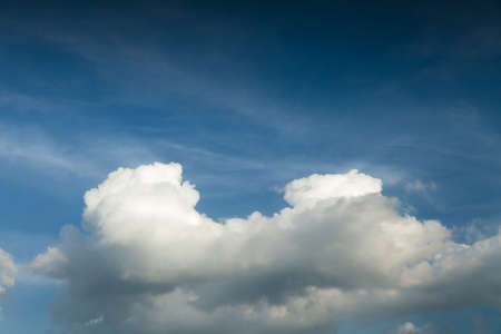 Dramatic white clouds and dark blue sky weather backgroundの写真素材