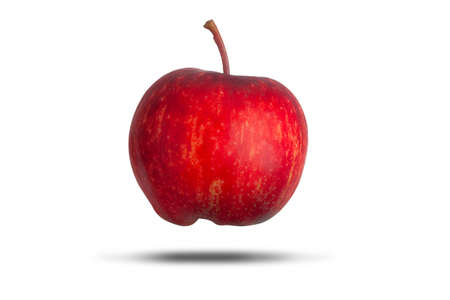 Delicious fresh red whole apple with stalk floating and isolated on a white background. Healthy diet and food symbolの写真素材