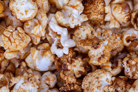 Tasty popcorn snack food close up backdrop viewed from aboveの写真素材