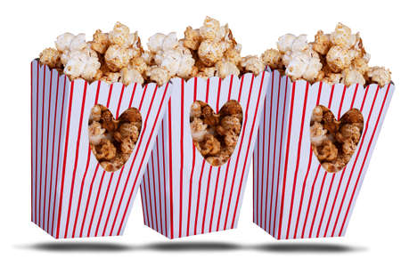Love popcorn concept with three popcorn boxes with love heart coutout on a white backgroundの写真素材