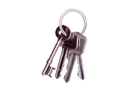 Bunch of keys on a keyring isolated on a white backgroundの写真素材