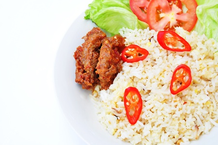 Delicious fried rice and meat close-up on whiteの写真素材