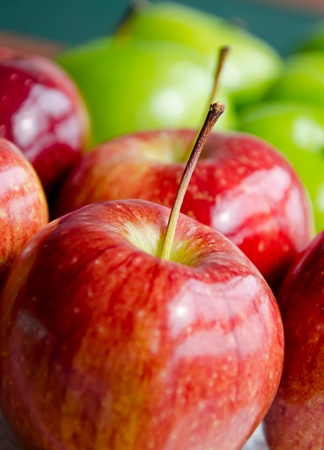 Red apple close up with green appleの写真素材