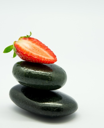 Strawberry fruit and spa rock  isolated の写真素材