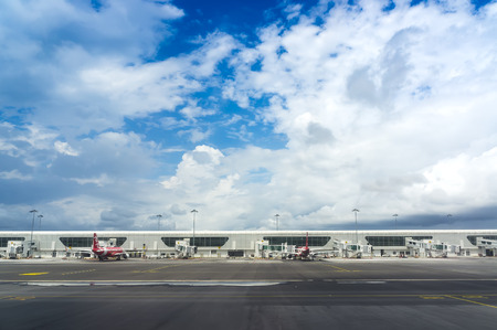 MALAYSIA-18 JULY 2016 - AirAsia Terminal in Kuala Lumpur Airport and storm clouds landscape. AirAsia is one of famous low cost airplanes at new Kuala Lumpur International Airport 2 terminal (KLIA 2).のeditorial素材