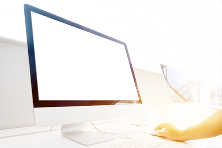 Hand using mouse with white screen desktop computer- information, connection, communication, and technology conceptの写真素材