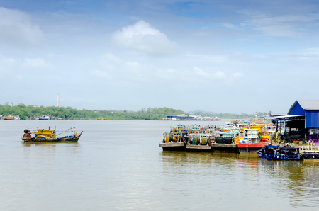 JOHOR, MALAYSIA - JANUARY 30, 2017: Fishing boats anchored at the jetty during the monsoon season at Endau, Johor, Malaysia. Endau is one of the most important fisheries in Johor.のeditorial素材