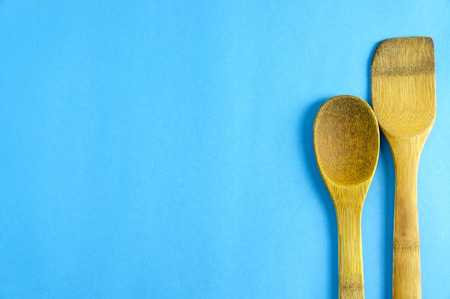 Ladle on blue background with top view and copy space for design foods, vegetable, spices, herbs, healthy lifestyle or other your content.の写真素材