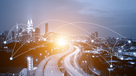 Blue tone Kuala Lumpur cityscape and network connection concept. Sunbeam effect.