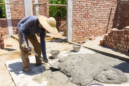 Mix a cement at construction site, tools and sand.の写真素材